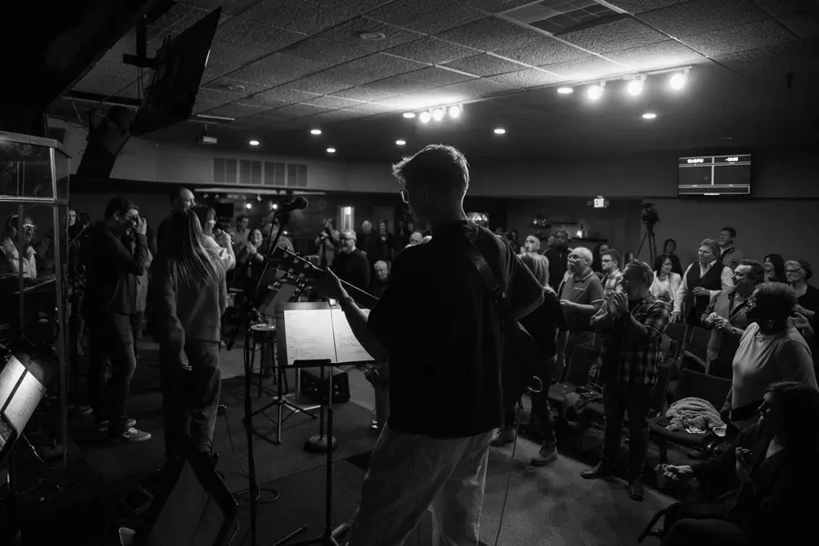 Black and white packed room during a concert