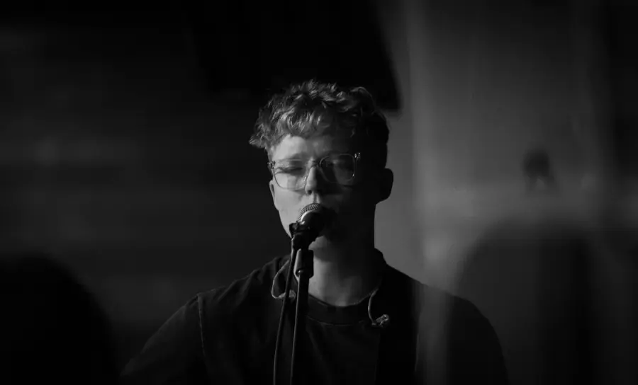 Black and white singer at the microphone