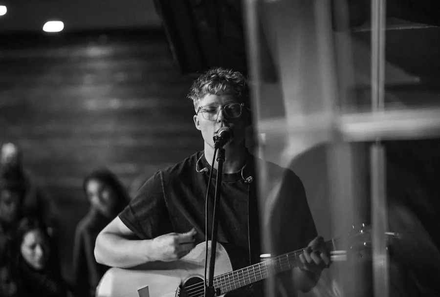 Black and white guitarist performing