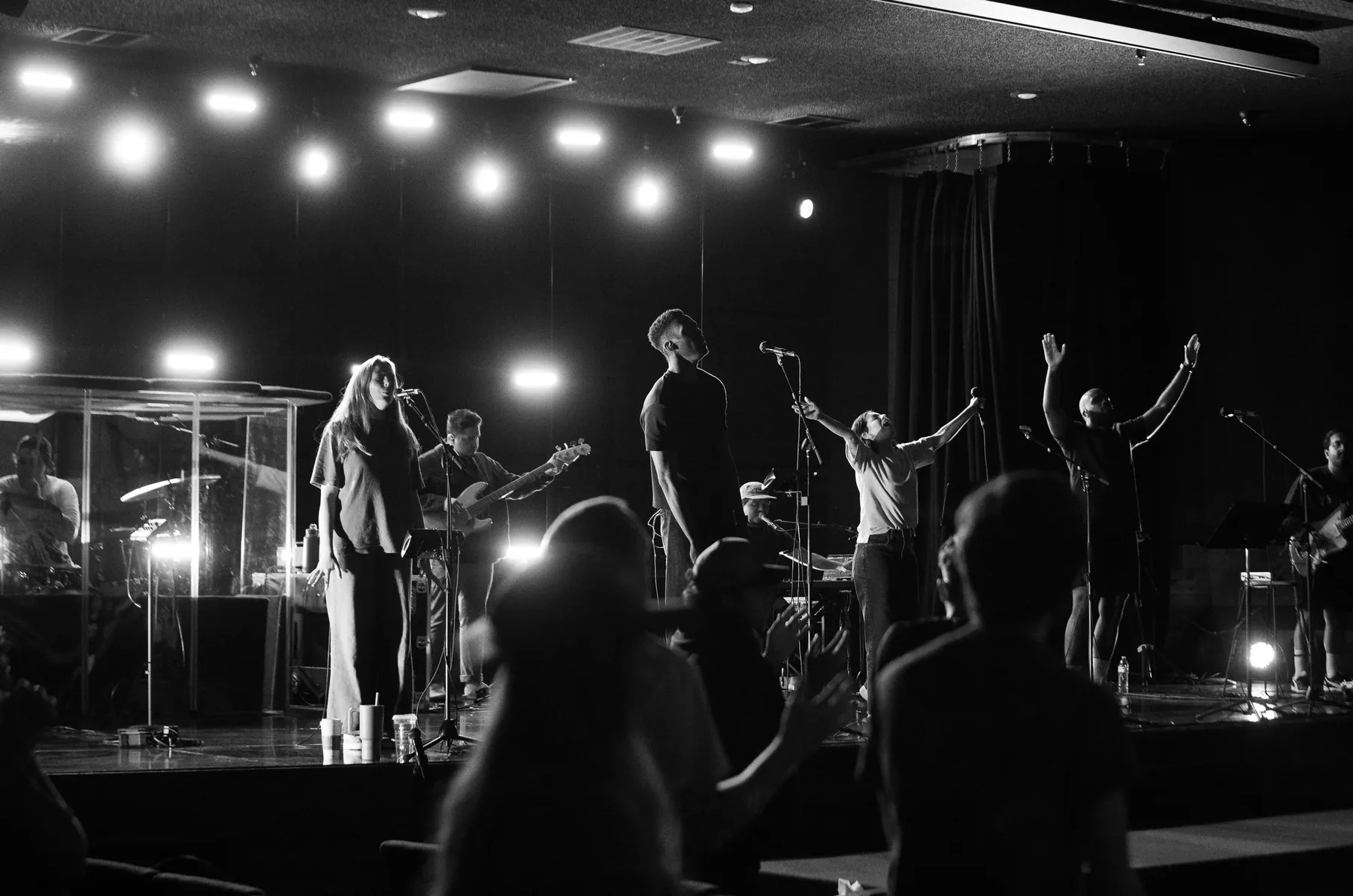 A concert crowd under bright stage lights