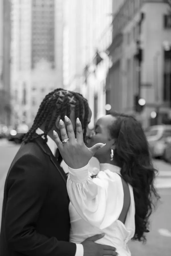 Black and white close up of a groom touching his bride's face